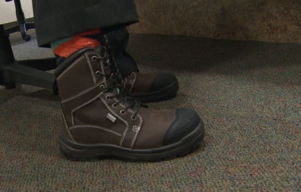 Hickes wore the same pair of work boots he sported for budget day last year, saying he hasn't had time to take them off. 