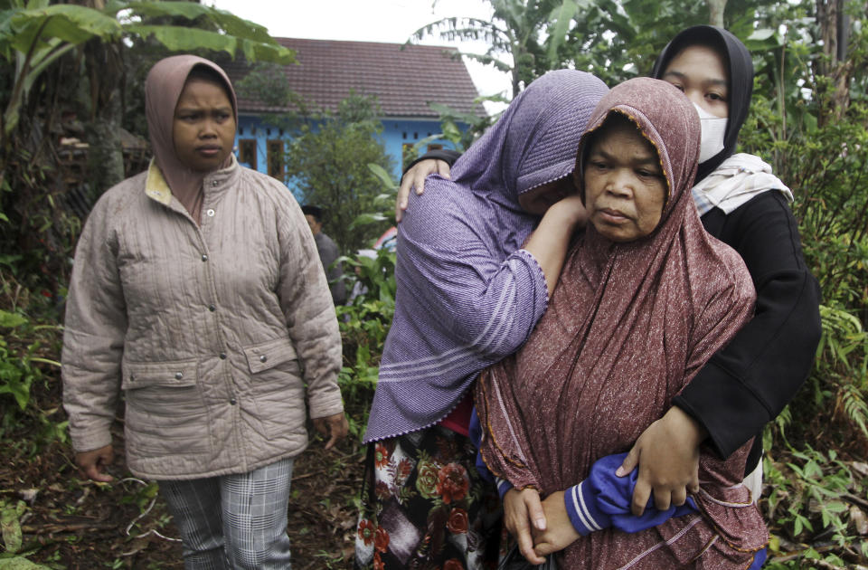 Women weep as the body of a family member killed in Monday's earthquake is taken away for burial in Cianjur, West Java, Indonesia, Wednesday, Nov. 23, 2022. More rescuers and volunteers were deployed Wednesday in devastated areas on Indonesia's main island of Java to search for the dead and missing from an earthquake that killed hundreds of people. (AP Photo)