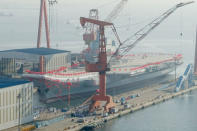 China's first domestically built aircraft carrier is seen during its launching ceremony in Dalian, Liaoning province, China. REUTERS/Stringer