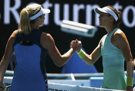 Tennis - Australian Open - Melbourne Park, Melbourne, Australia - 24/1/17 Coco Vandeweghe of the U.S. shakes hands after winning her Women's singles quarter-final match against Spain's Garbine Muguruza. REUTERS/Issei Kato