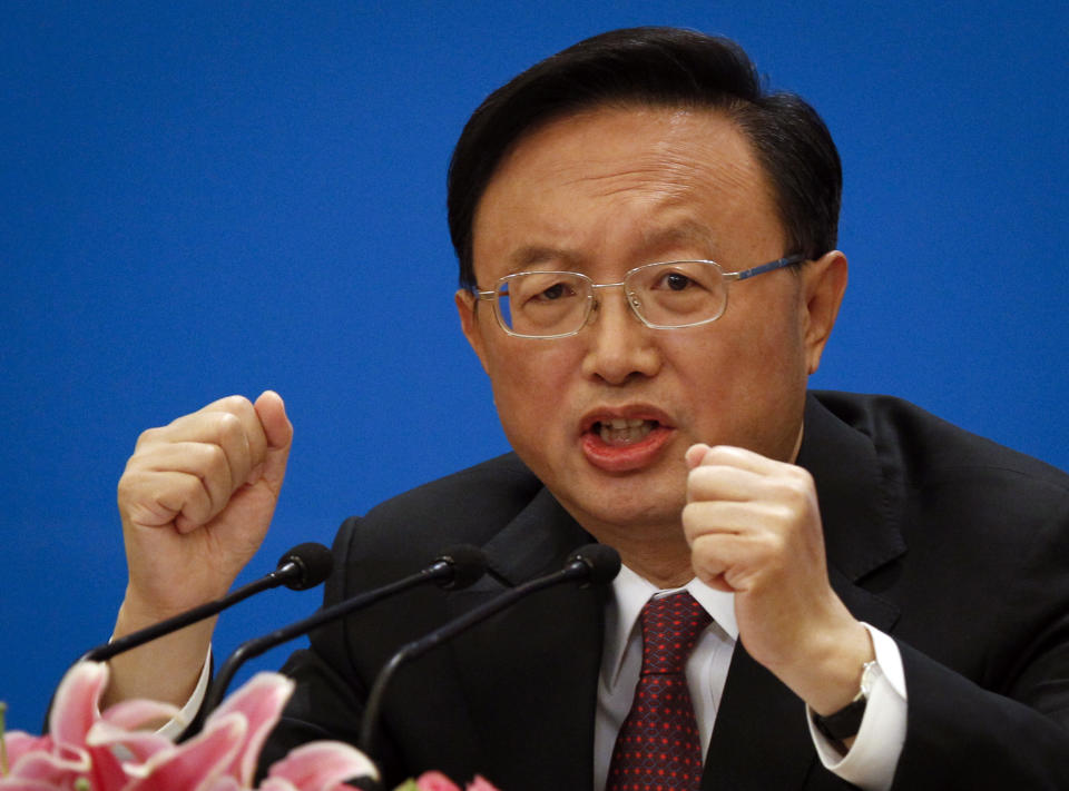 China's Foreign Minister Yang Jiechi gestures during a press conference at the Great Hall of the People in Beijing, China, Tuesday, March 6, 2012. Yang said Tuesday that Beijing and Washington need to build more trust, though he suggested the onus is on the U.S. to respect Chinese interests on issues such as Taiwan and Tibet. (AP Photo/ Vincent Thian)