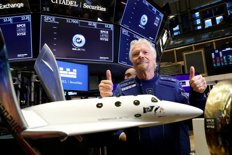 FILE PHOTO: Sir Richard Branson poses on floor of New York Stock Exchange (NYSE) ahead of Virgin Galactic (SPCE) trading in New York