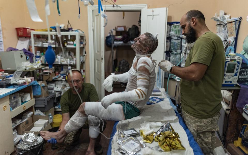 Ukrainian army medics treat wounded soldiers