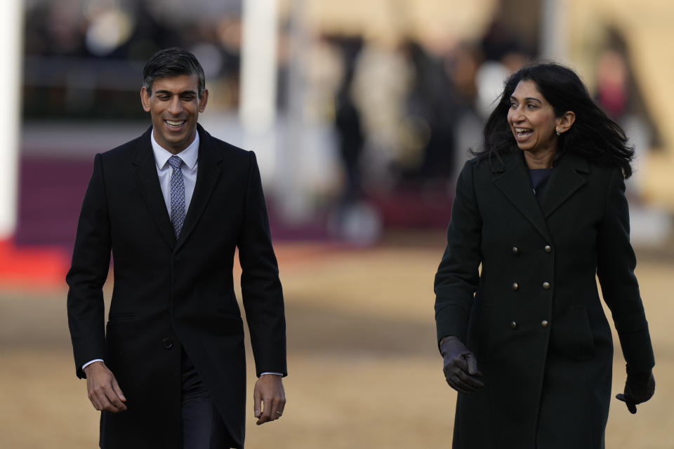 FILE - Britain's Prime Minister Rishi Sunak, left, and Suella Braverman, the Home Secretary, walk, after attending the Ceremonial Welcome for the President of South Africa Cyril Ramaphosa at Horse Guards Parade in London, Nov. 22, 2022. British Prime Minister Rishi Sunak has fired Home Secretary Suella Braverman, who drew anger for accusing police of being too lenient with pro-Palestinian protesters. The government says Braverman has left her job as part of a Cabinet shuffle on Monday, Nov. 13, 2023. (AP Photo/Alastair Grant, File)