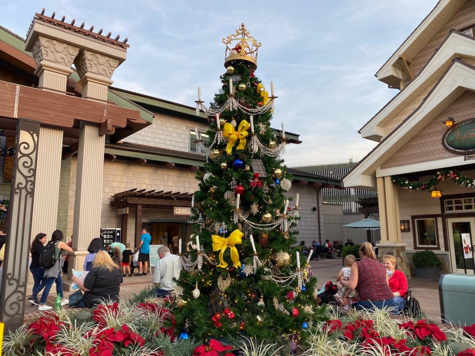 A "Beauty and the Beast" Christmas tree at Disney Springs in December 2021.