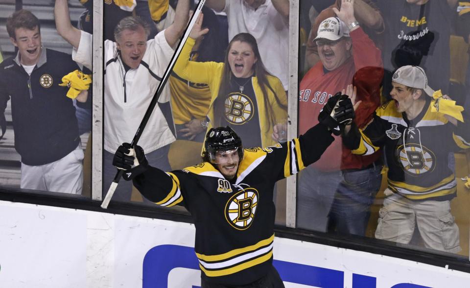 Boston Bruins left wing Loui Eriksson (21) celebrates his goal against Montreal Canadiens goalie Carey Price during the third period of Game 5 in the second-round of the Stanley Cup hockey playoff series in Boston, Saturday, May 10, 2014. (AP Photo/Charles Krupa)