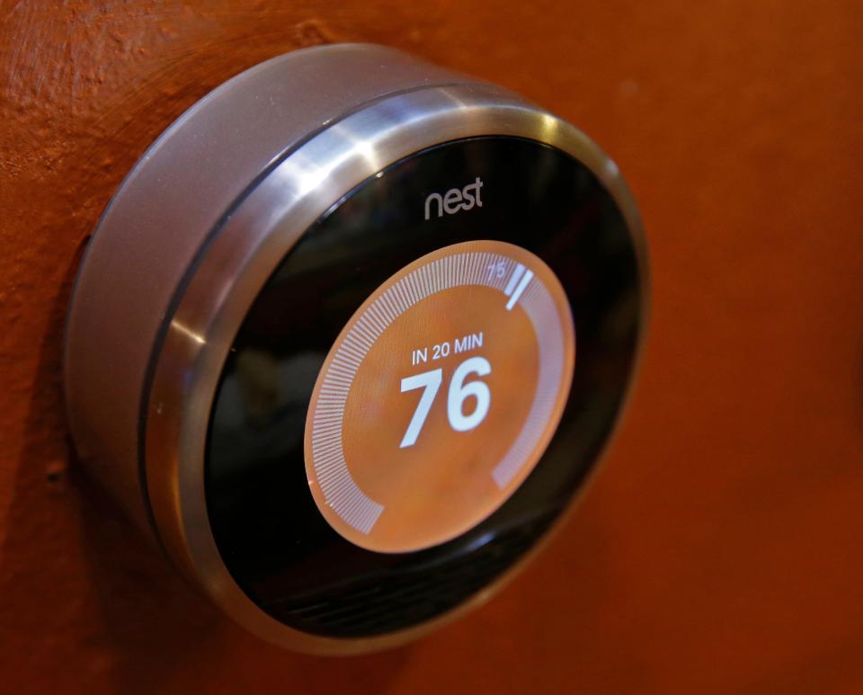 A Nest thermostat is seen on a wall in a home on January 16, 2014 in Provo, Utah.
