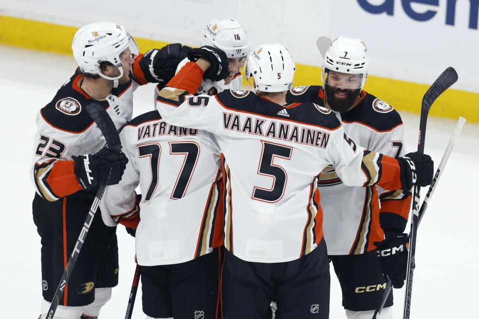 Anaheim Ducks' Radko Gudas (7) celebrates his goal against the Boston Bruins with Urho Vaakanainen (5), Frank Vatrano (77), Mason McTavish (23) and Ryan Strome (16) during the first period of an NHL hockey game Thursday, Oct. 26, 2023, in Boston. (AP Photo/Michael Dwyer)