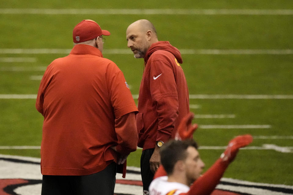 Kansas City Chiefs head coach Andy Reid, left, and offensive coordinator Matt Nagy talk during the NFL football team's practice Wednesday, Jan. 24, 2024, in Kansas City, Mo. (AP Photo/Charlie Riedel)