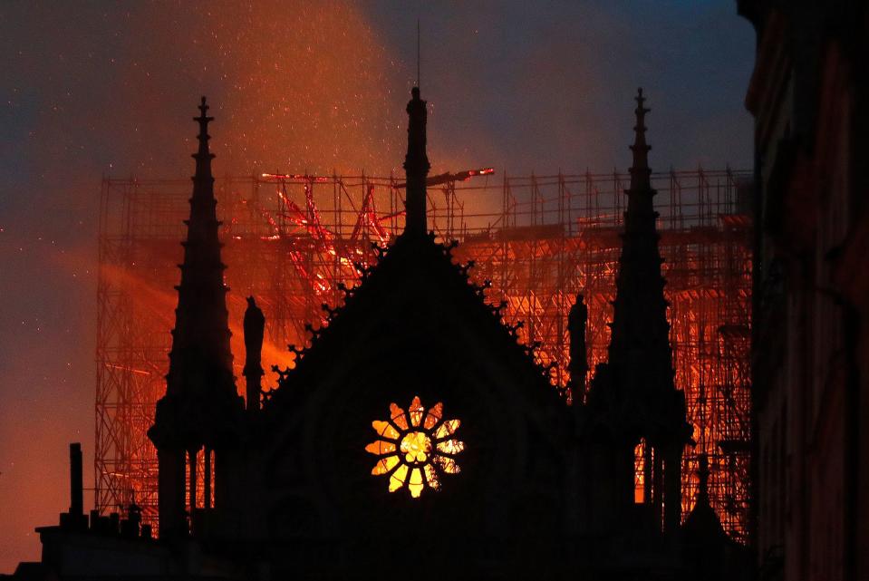 As night fell, groups of <a rel="nofollow noopener" href="https://people.com/travel/notre-dame-cathedral-fire-onlookers-singing-ave-maria/" target="_blank" data-ylk="slk:onlookers began singing "Ave Maria";elm:context_link;itc:0;sec:content-canvas" class="link ">onlookers began singing "Ave Maria"</a> while watching the cathedral go up in flames. Although officials had previously thought the structure would be unsalvageable after the blaze, a fire official <a rel="nofollow noopener" href="https://www.cnbc.com/2019/04/15/paris-notre-dame-cathedral-on-fire-reuters.html" target="_blank" data-ylk="slk:told CNBC;elm:context_link;itc:0;sec:content-canvas" class="link ">told CNBC</a> that as of 11:20 p.m. local time, the main building's integrity had been saved and the fire had been contained.