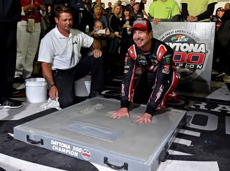 Feb 26, 2017; Daytona Beach, FL, USA; NASCAR Cup Series driver Kurt Busch (41) puts his hand in concrete after winning the 2017 Daytona 500 at Daytona International Speedway. Jasen Vinlove-USA TODAY Sports