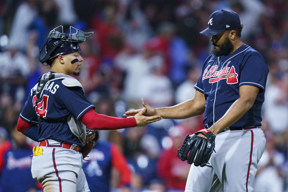 Atlanta Braves' William Contreras, left, celebrates the win with Atlanta Braves relief pitcher Kenley Jansen, right, following the ninth inning of a baseball game against the Philadelphia Phillies, Saturday, Sept. 24, 2022, in Philadelphia. The Braves won 6-3. (AP Photo/Chris Szagola)