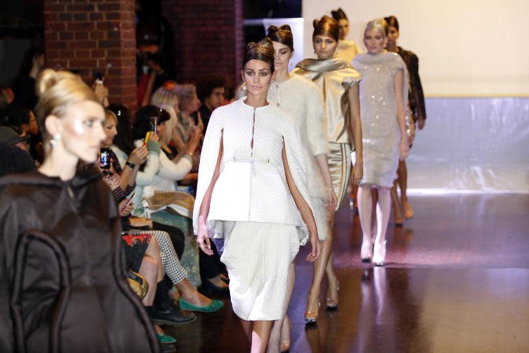 Models present creations from Corrie Nielsen's 2015 Spring/Summer ready-to-wear collection, on September 23, 2014 in Paris