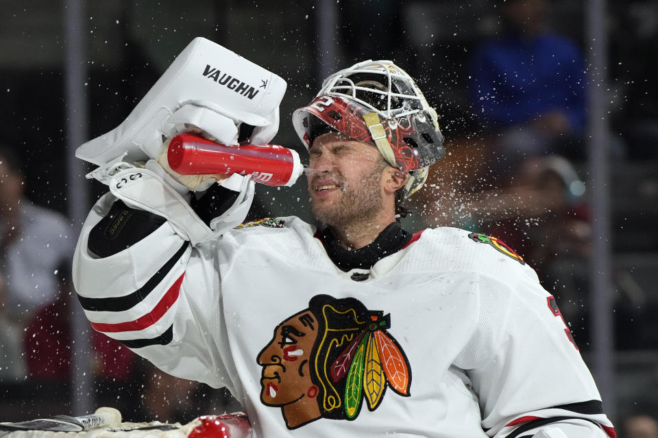 Chicago Blackhawks goaltender Alex Stalock cools off in the first period during an NHL hockey game against the Arizona Coyotes, Tuesday, Feb. 28, 2023, in Tempe, Ariz. (AP Photo/Rick Scuteri)