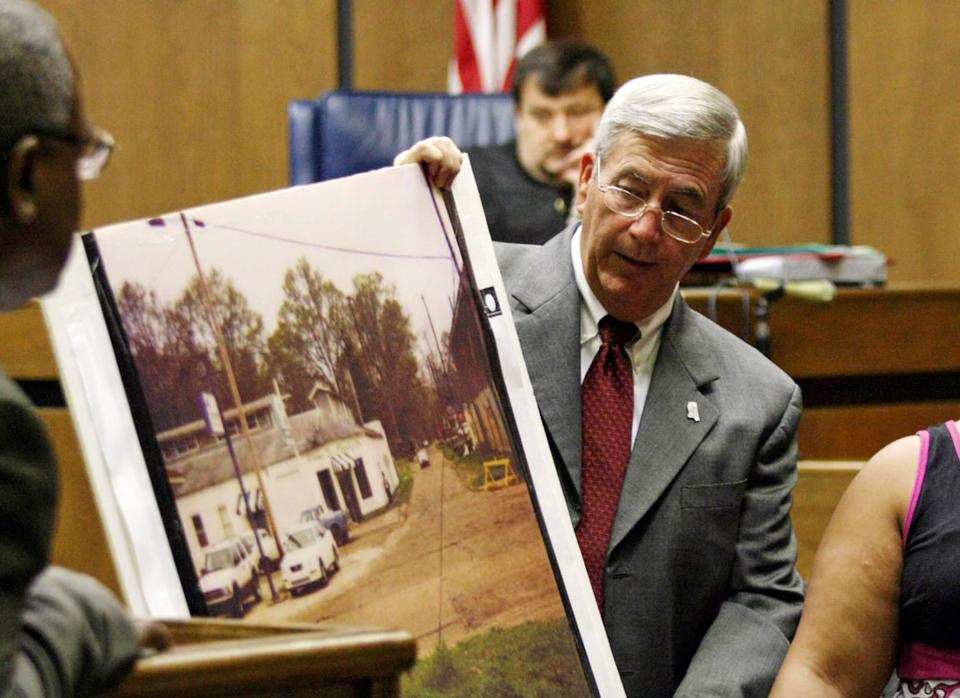 Prosecutor Doug Evans holds a photo during a trial for Curtis Flowers in 2010.