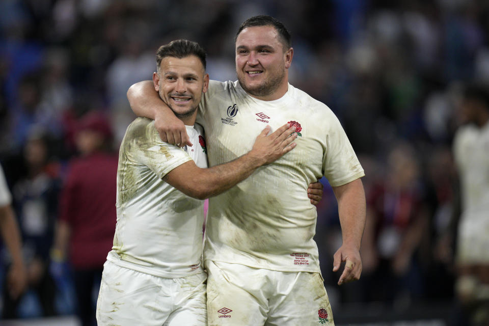 England's Jamie George, right, Danny Care celebrate after the Rugby World Cup quarterfinal match between England and Fiji at the Stade de Marseille in Marseille, France, Sunday, Oct. 15, 2023. (AP Photo/Daniel Cole)