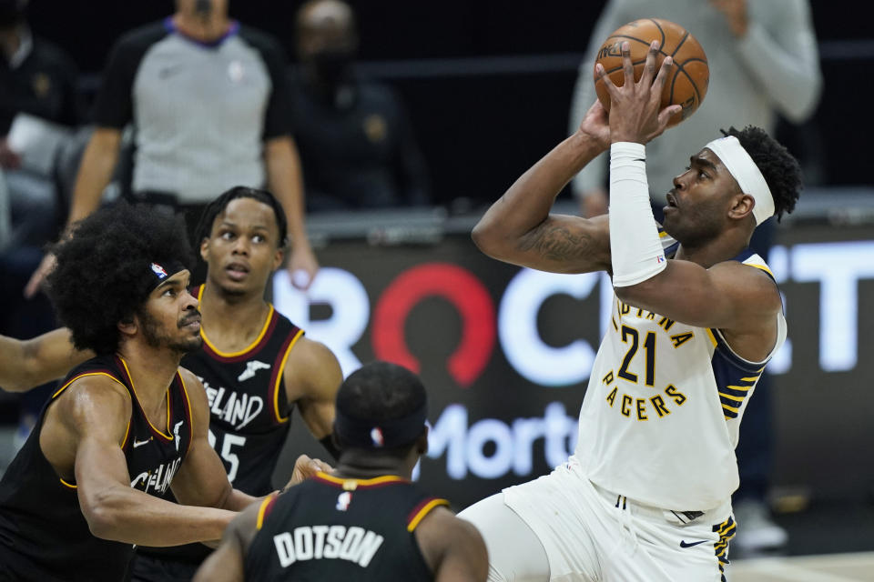 Indiana Pacers' Kelan Martin (21) shoots against the Cleveland Cavaliers in the second half of an NBA basketball game, Monday, May 10, 2021, in Cleveland. The Pacers won 111-102. (AP Photo/Tony Dejak)