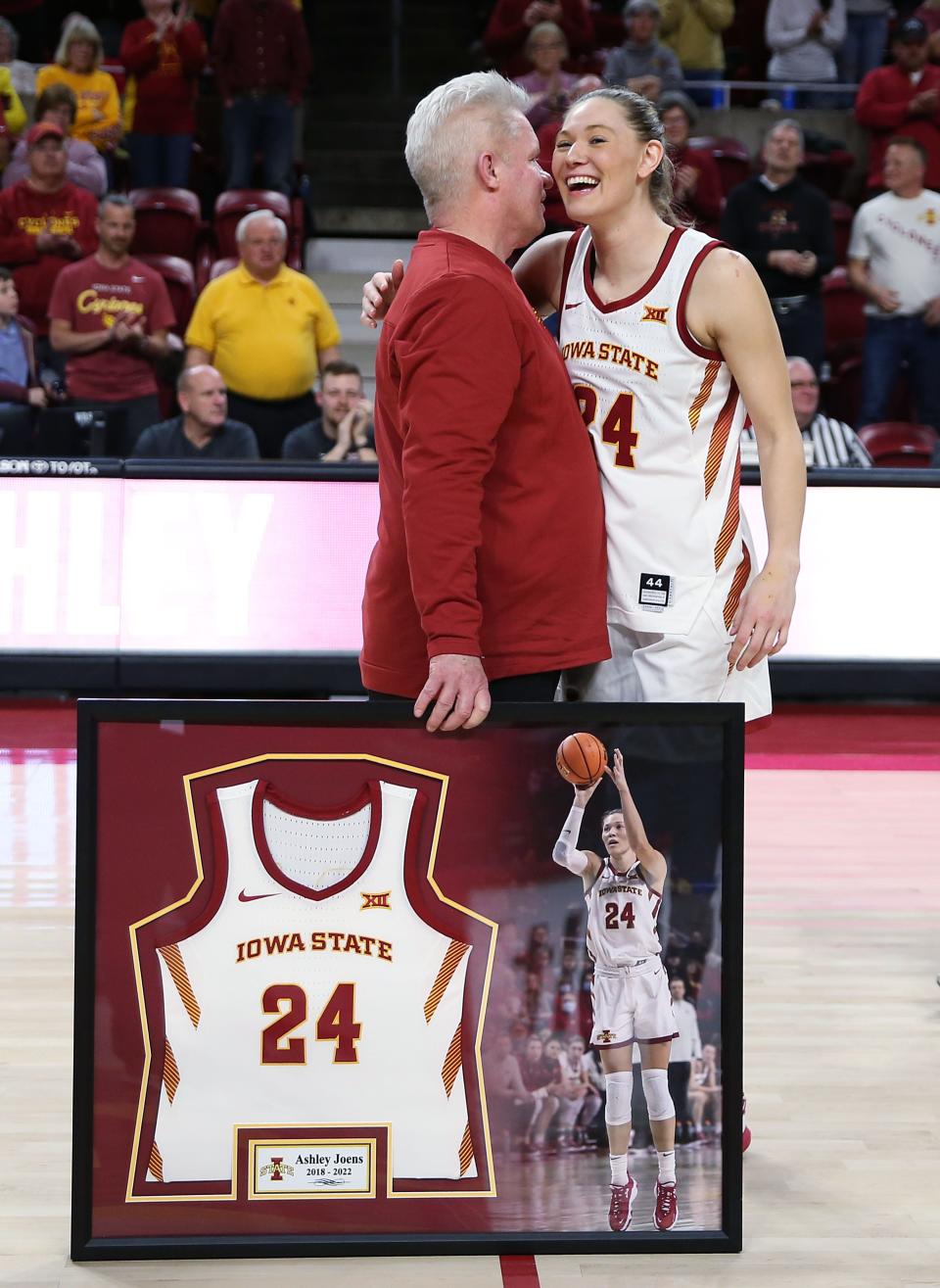 Iowa State coach Bill Fennelly greets Ashley Joens while presenting a framed jersey on senior day at Hilton Coliseum on March 4, 2023.