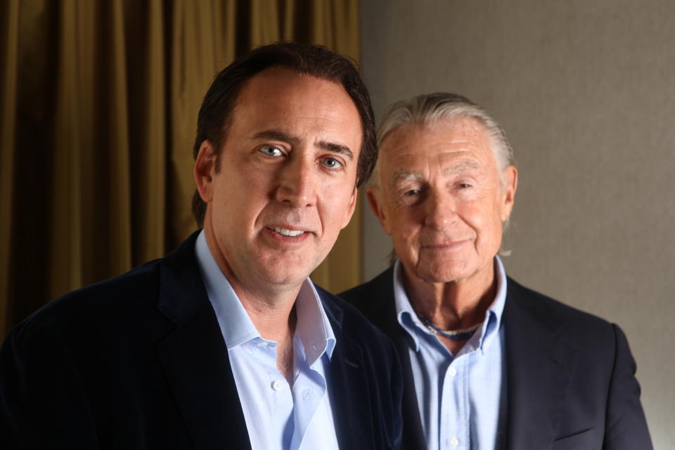 FILE - In this Sept. 14, 2011 file photo, actor Nicolas Cage, left, and director Joel Schumacher pose for a portrait during the 36th Toronto International Film Festival in Toronto, Canada. The story of a family terrorized by home intruders, “Trespass” debuts Friday, Oct. 14, for a limited theatrical run in New York.  (AP Photo/Carlo Allegri, file)