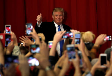 U.S. Republican presidential candidate Donald Trump greets supporters as he arrives to appear with New Jersey Governor Chris Christie at a fundraising event in Lawrenceville, New Jersey, U.S., Many 19, 2016. REUTERS/Mike Segar