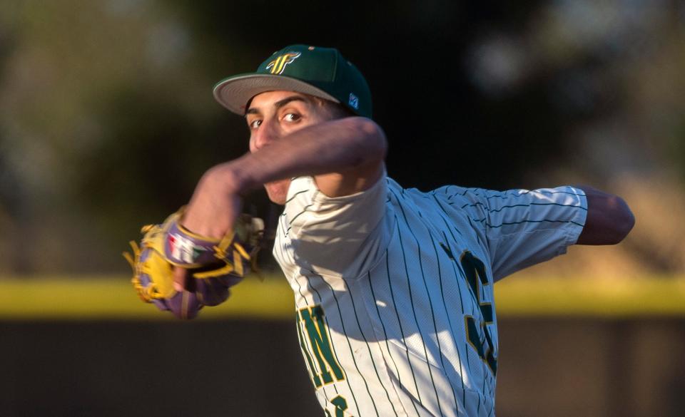 Franklin's Parker Burks winds up to deliver a pitch during a varsity baseball game at Stagg in Stockton on Thursday, Mar. 23, 2023.