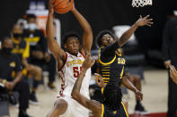 Iowa State guard Darlinstone Dubar, top left, looks to pass under the basket as Arkansas-Pine Bluff guards Dequan Morris, center, and Joshuwa Johnson, right, defend during the first half of an NCAA college basketball game, Sunday, Nov. 29, 2020, in Ames, Iowa. (AP Photo/Matthew Putney)