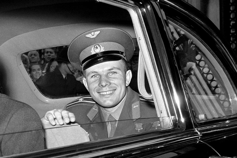 FILE - In this Friday, July 14, 1961 file photo, Major Yuri Gagarin, the Russian cosmonaut, smiles as he leaves Buckingham Palace in London, United Kingdom, after lunch with Queen Elizabeth II. He is visiting Britain in connection with the soviet exhibition in London. The successful one-orbit flight on April 12, 1961 made the 27-year-old Gagarin a national hero and cemented Soviet supremacy in space until the United States put a man on the moon more than eight years later. (AP Photo/Brian Calvert, File)