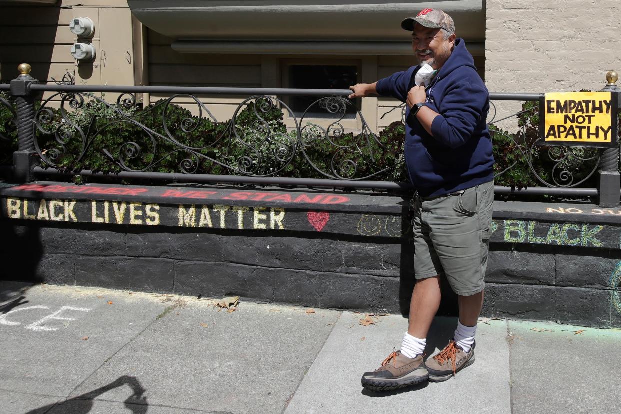 James Juanillo chalked 'Black Lives Matter' on his own wall – and was accused of illegal action by someone who assumed he didn't live there: AP