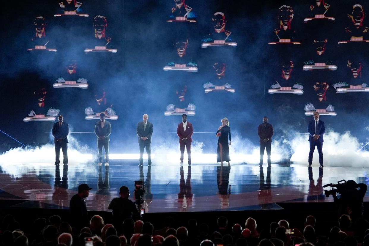 Pro Football Hall of Fame Class of 2024, Dwight Freeney, Andre Johnson, Randy Gradishar, Patrick Willis, Steve McMichael (wife Misty McMichael accepting), Devin Hester and Julius Peppers stand on stage during the NFL Honors award show, Thursday, Feb. 8, 2024, in Las Vegas.