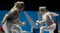 Mariel Zagunis (L) of the USA competes against Angelica Larios of Mexico in a team's sabre gold medal match, during the Guadalajara 2011 Pan American Games, in Guadalajara, Mexico, on October 28, 2011. AFP PHOTO/OMAR TORRES (Photo credit should read OMAR TORRES/AFP/Getty Images)