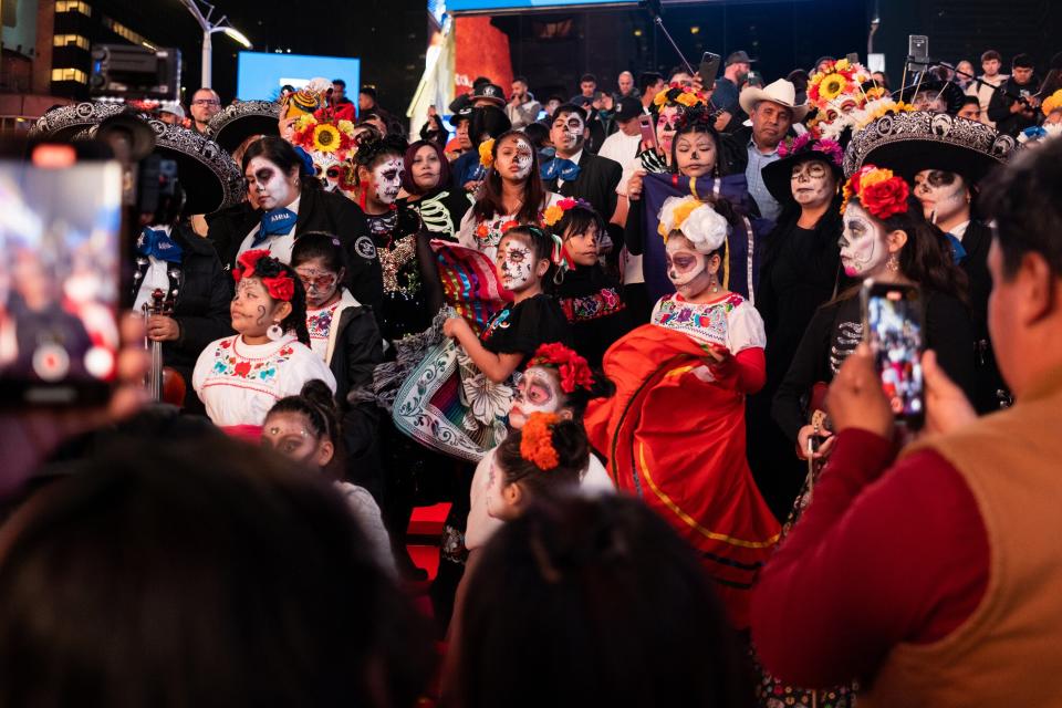 People participate in 'Día de los Muertos', or Day of The Dead, celebrations in Times Square on October 30, 2022 in New York City. Day of the Dead is a celebratory holiday traditionally celebrated on November 1-2 to remember the dead.