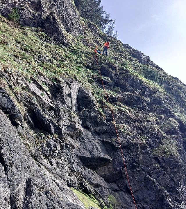 search and rescuer on steep and rocky slope