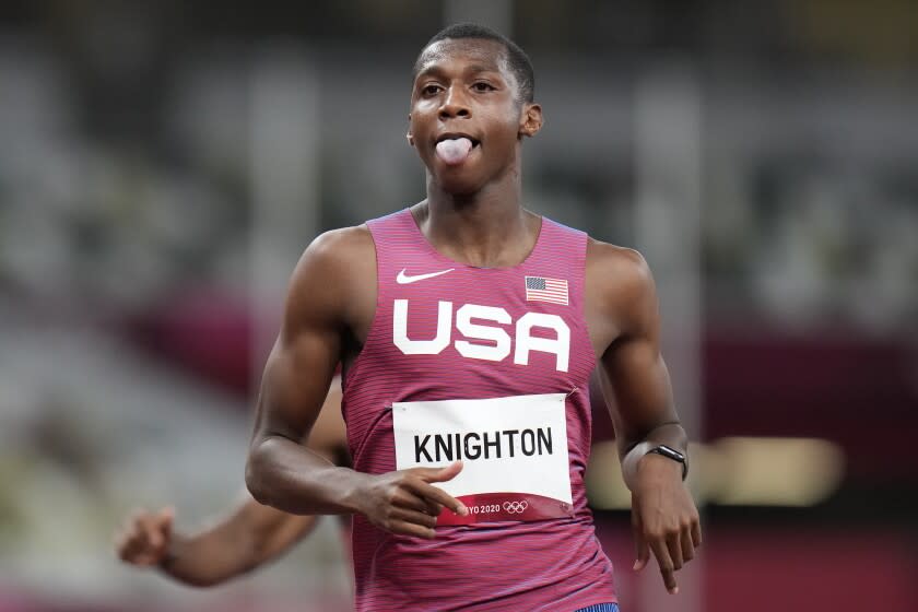 Erriyon Knighton, of the United States, reacts after his semifinal of the men's 200-meters.