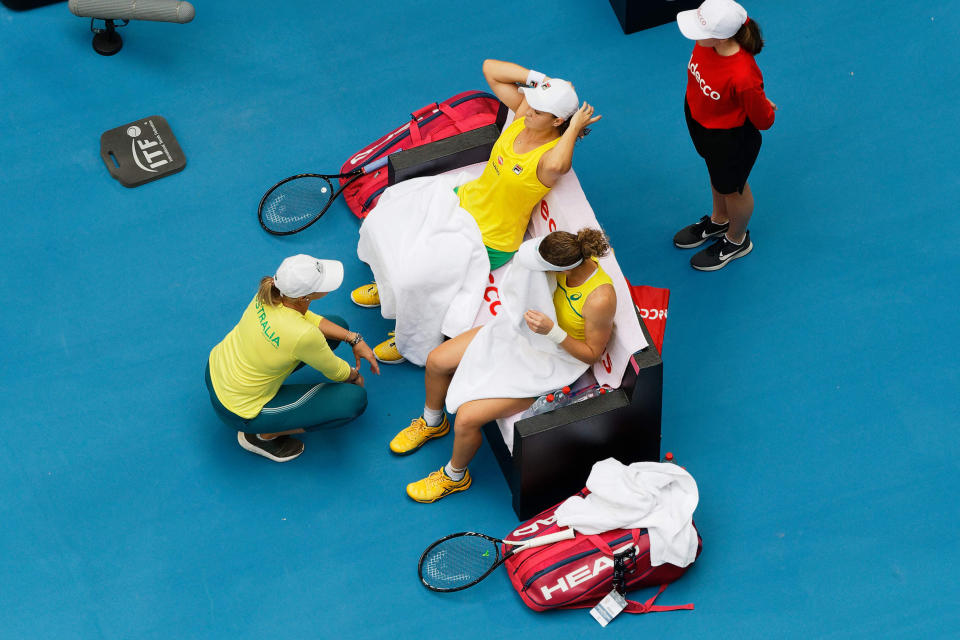 Australian captain Alicia Molik urges her players Ash Barty and Sam Stosur during a points break in their Fed Cup tennis final in Perth, Australia, Sunday, Nov. 10, 2019. (AP Photo/Trevor Collens)