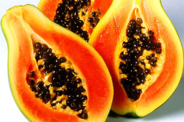 Joff Lee/Getty Images Papayas cut in half.