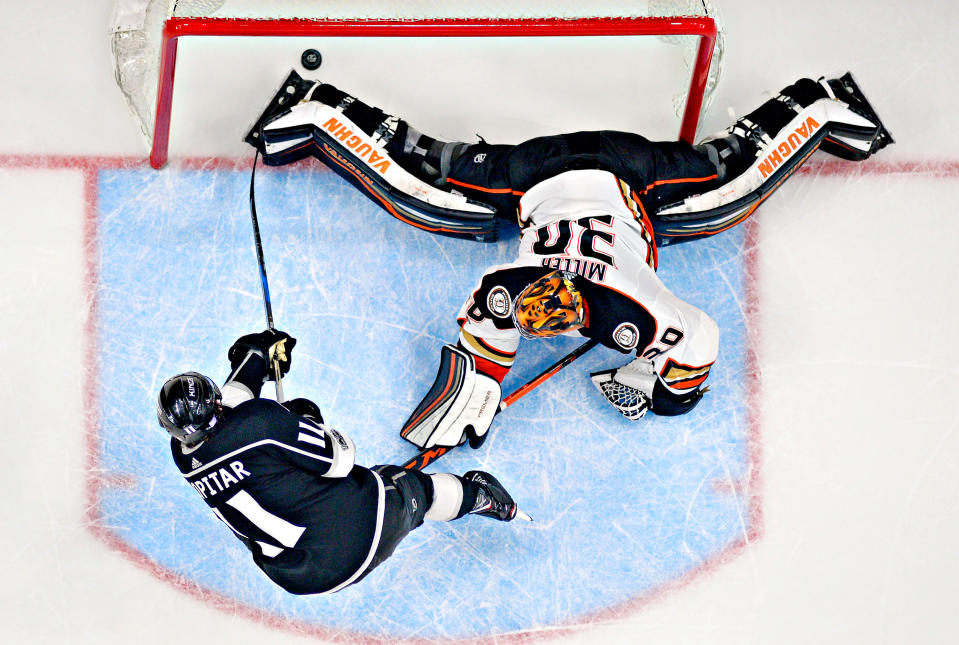 <p>Los Angeles Kings center Anze Kopitar, left, of Slovenia, scores the game-winner on Anaheim Ducks goalie Ryan Miller during an overtime shootout of an NHL hockey game, Saturday, Nov. 25, 2017, in Los Angeles. The Kings won 2-1 in an overtime shoot out. (AP Photo/Mark J. Terrill) </p>