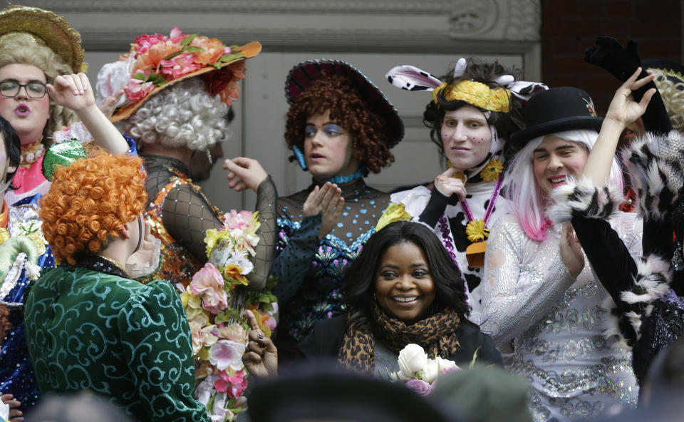 Actress Octavia Spencer, right center, bottom row, poses with members of Harvard's Hasty Pudding Theatricals after a parade to honor Spencer as the Hasty Pudding Theatricals Woman of the Year Thursday, Jan. 26, 2017, in Cambridge, Mass. (AP Photo/Stephan Savoia)