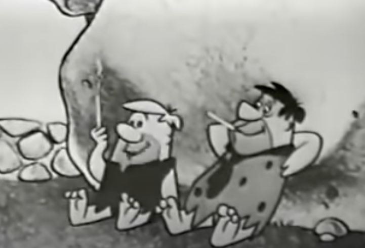 Fred Flintstone and Barney Rubble sit against a rock, both smoking, in a classic black-and-white scene from 