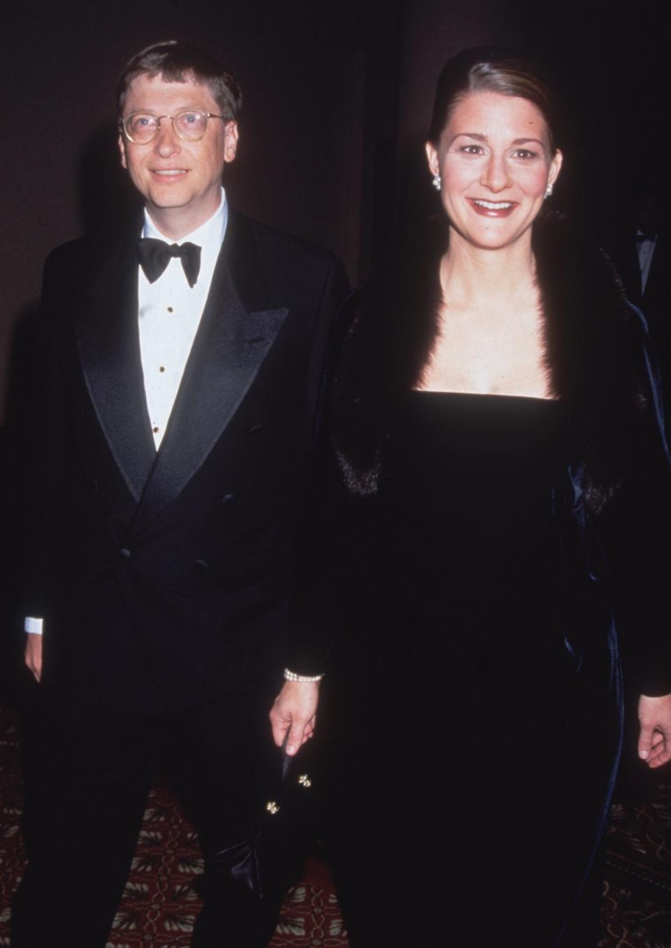 Bill Gates and his wife Melinda stand together, wearing formal attire, New York City