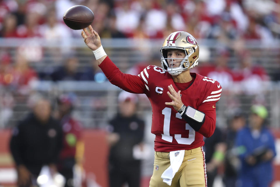 San Francisco 49ers quarterback Brock Purdy (13) passes against the Dallas Cowboys during the first half of an NFL football game in Santa Clara, Calif., Sunday, Oct. 8, 2023. (AP Photo/Jed Jacobsohn)