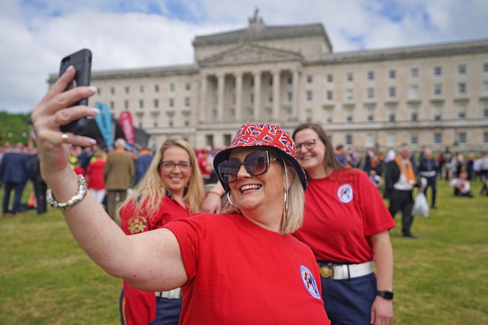 People gather at Stormont (Niall Carson/PA) (PA Wire)