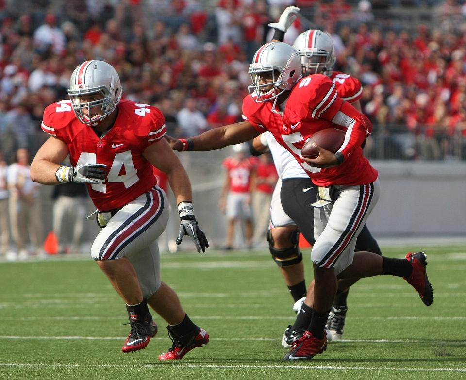Zach Boren, left, had played fullback since coming to Ohio State in 2009. But with the linebacking corps depleted by injury this season, coach Urban Meyer switched Boren to defense before the Indiana game.