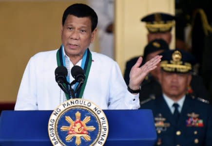 FILE PHOTO: Philippine President Rodrigo Duterte gestures during the change of command ceremony of the Armed Forces of the Philippines (AFP) at Camp Aguinaldo in Quezon City, Metro Manila, Philippines April 18, 2018.   REUTERS/Dondi Tawatao