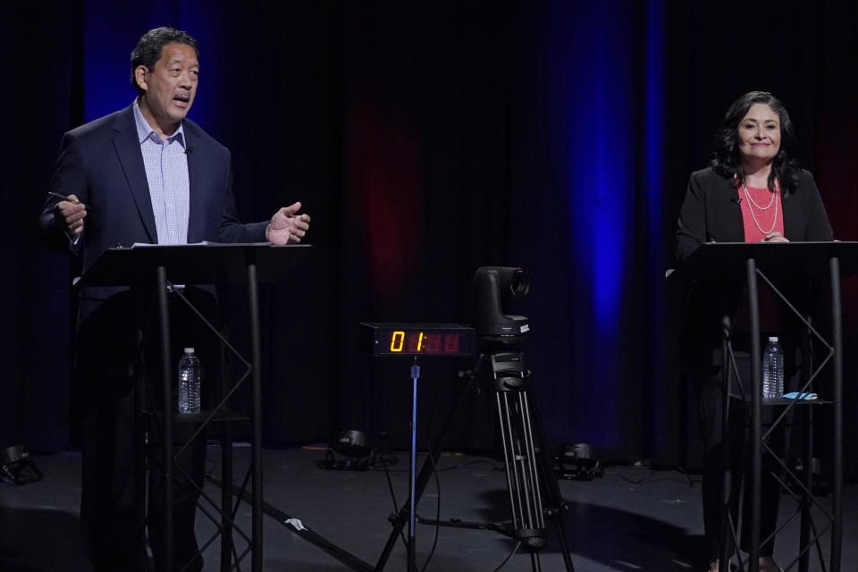 Bruce Harrell, left, and Lorena Gonzalez, right, take part Thursday, Oct. 14, 2021, in the first of two debates in Seattle scheduled before the November election for the office of mayor. (AP Photo/Ted S. Warren, Pool)