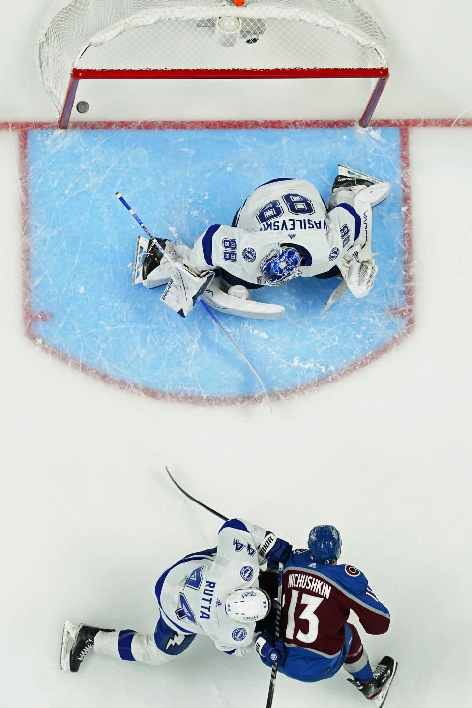 Colorado Avalanche right wing Valeri Nichushkin (13) scores on Tampa Bay Lightning goaltender Andrei Vasilevskiy (88) during the first period in Game 2 of the NHL hockey Stanley Cup Final, Saturday, June 18, 2022, in Denver. (AP Photo/John Locher)