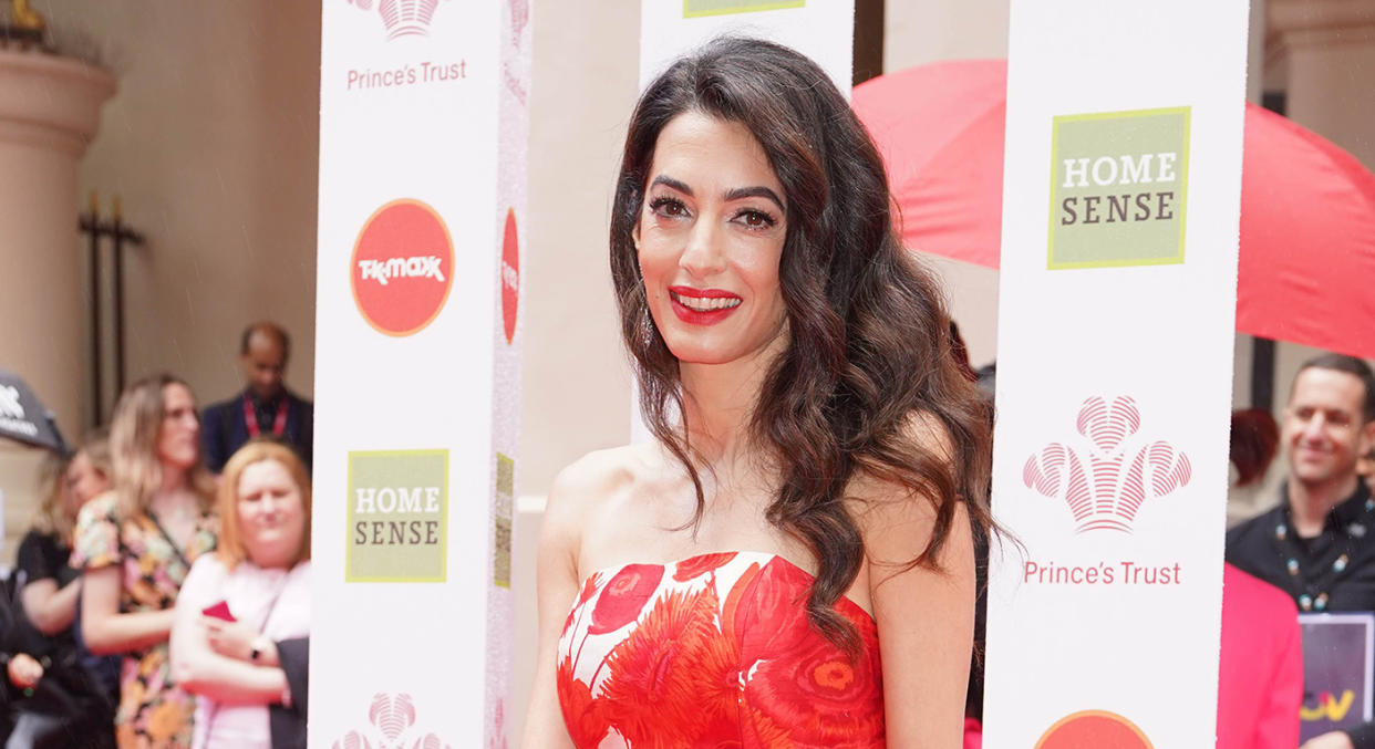 Amal Clooney left her legal attire at home and opted for a strapless dress at the Prince's Trust Awards. (Getty Images)