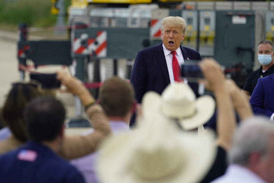 Former President Donald Trump reacts as he arrives for a visit to an unfinished section of border wall with Texas Gov. Greg Abbott, in Pharr, Texas, Wednesday, June 30, 2021. (AP Photo/Eric Gay)