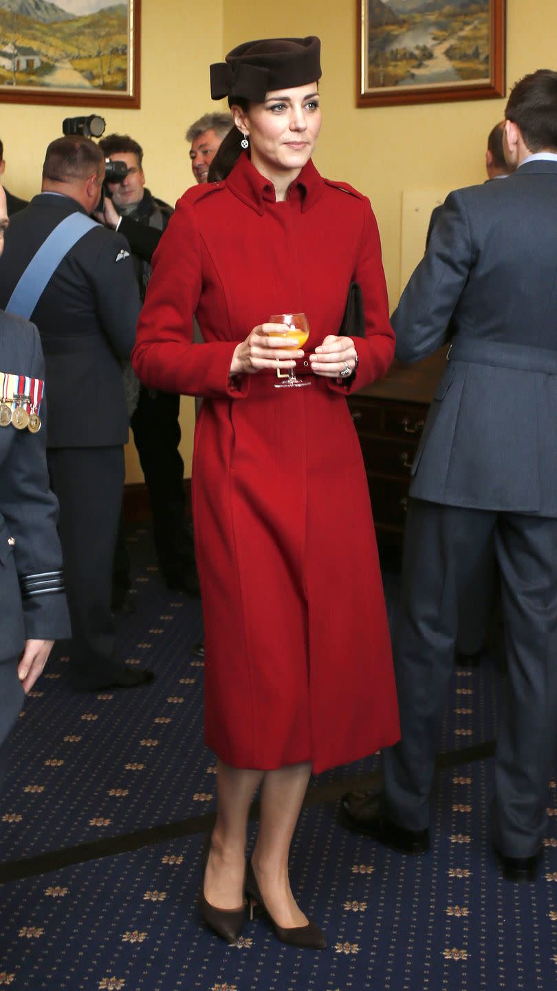 <p>The Duchess looked regal in rouge wearing an L.K.Bennett coat in Anglesey, Wales as she attended a ceremony marking the end of RAF Search and Rescue at the Royal Air Force Valley.</p>