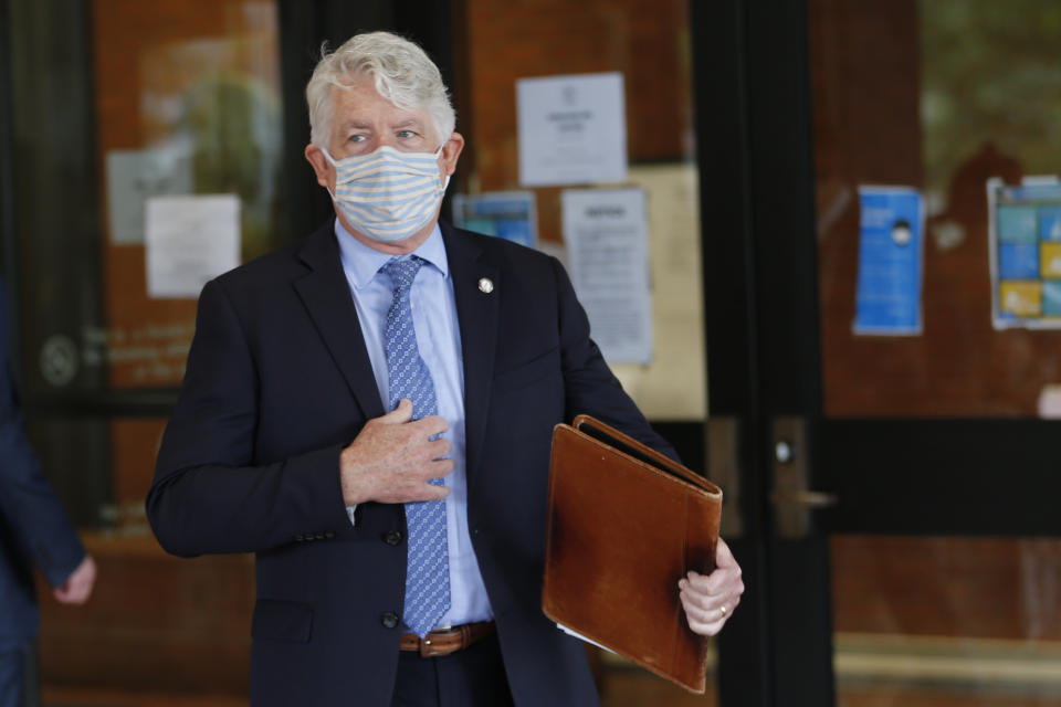 Virginia Attorney General Mark Herring walks out of Richmond General District Court Thursday June 18, 2020, in Richmond, Va. Herring responded to questions concerning a judges extension of an injunction preventing the removal of the statue of Confederate General Robert E. Lee on Monument Ave. in Richmond. (AP Photo/Steve Helber)