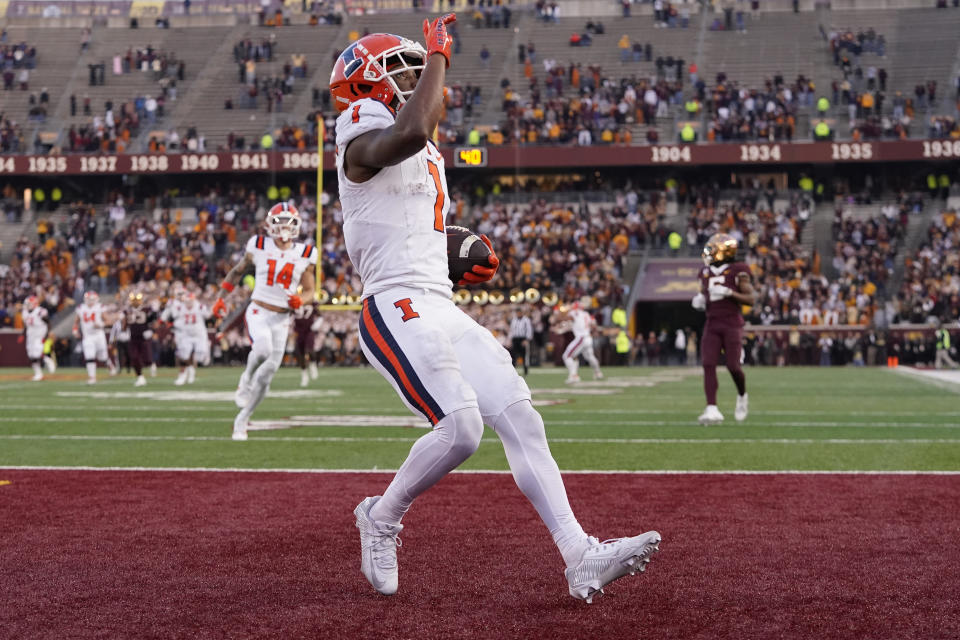 Illinois wide receiver Isaiah Williams (1) celebrates after scoring a 46-yard touchdown against Minnesota during the second half of an NCAA college football game Saturday, Nov. 4, 2023, in Minneapolis. (AP Photo/Abbie Parr)